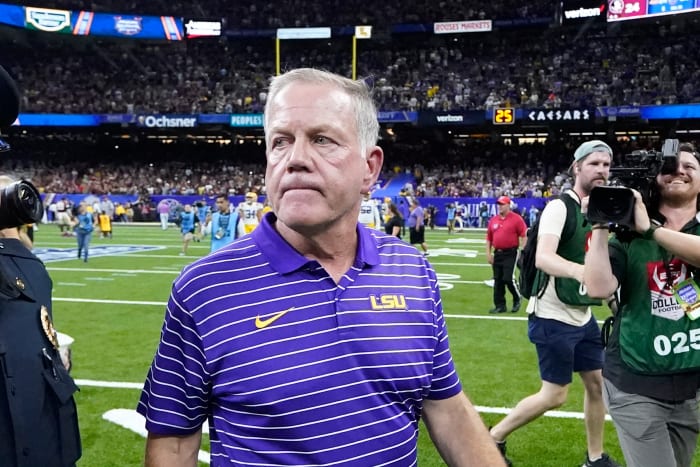LSU coach Brian Kelly walks off field after opening-season loss.